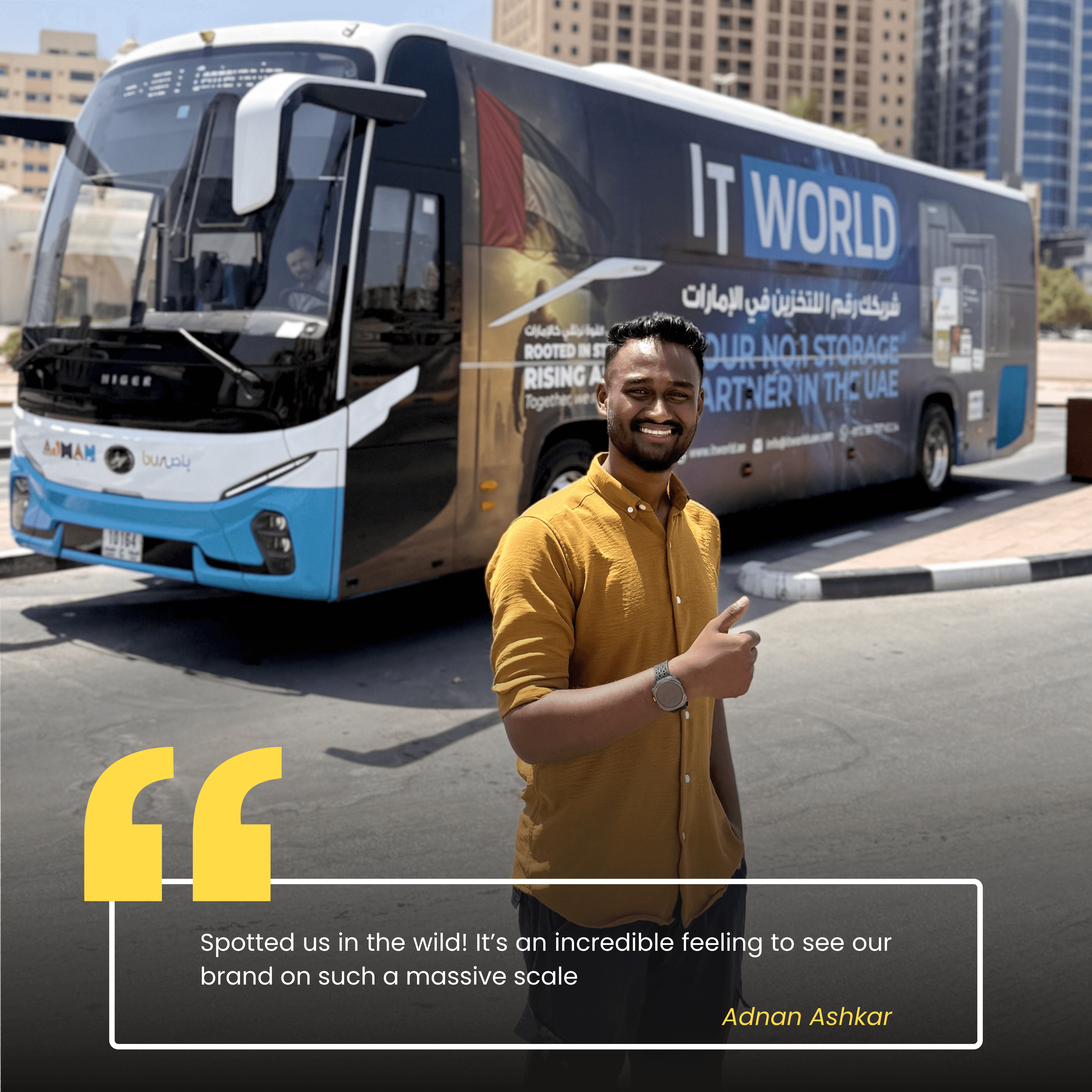 Adnan — IT World Trading team member, photographed beside the RTA campaign bus