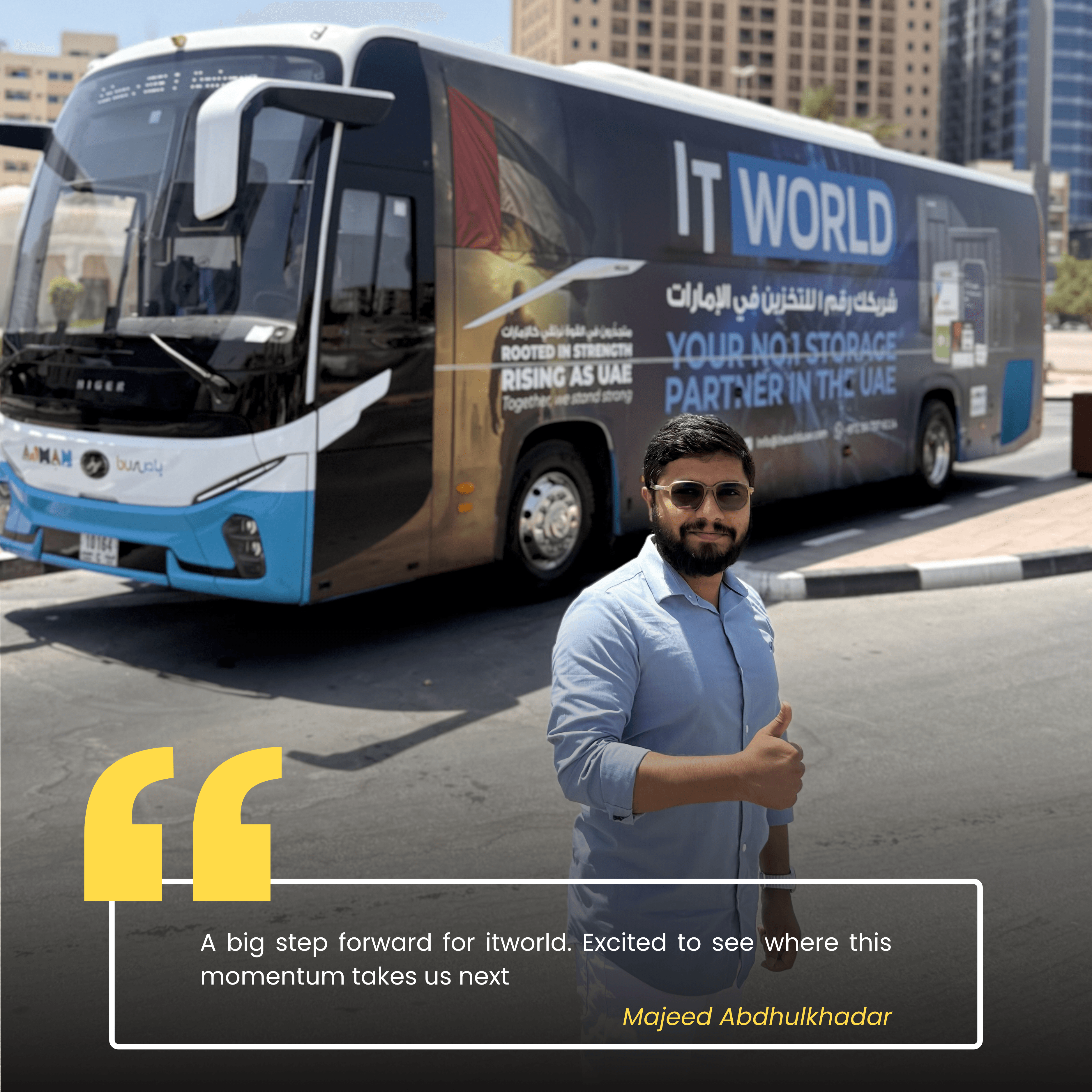 Majeed — IT World Trading team member, photographed beside the RTA campaign bus
