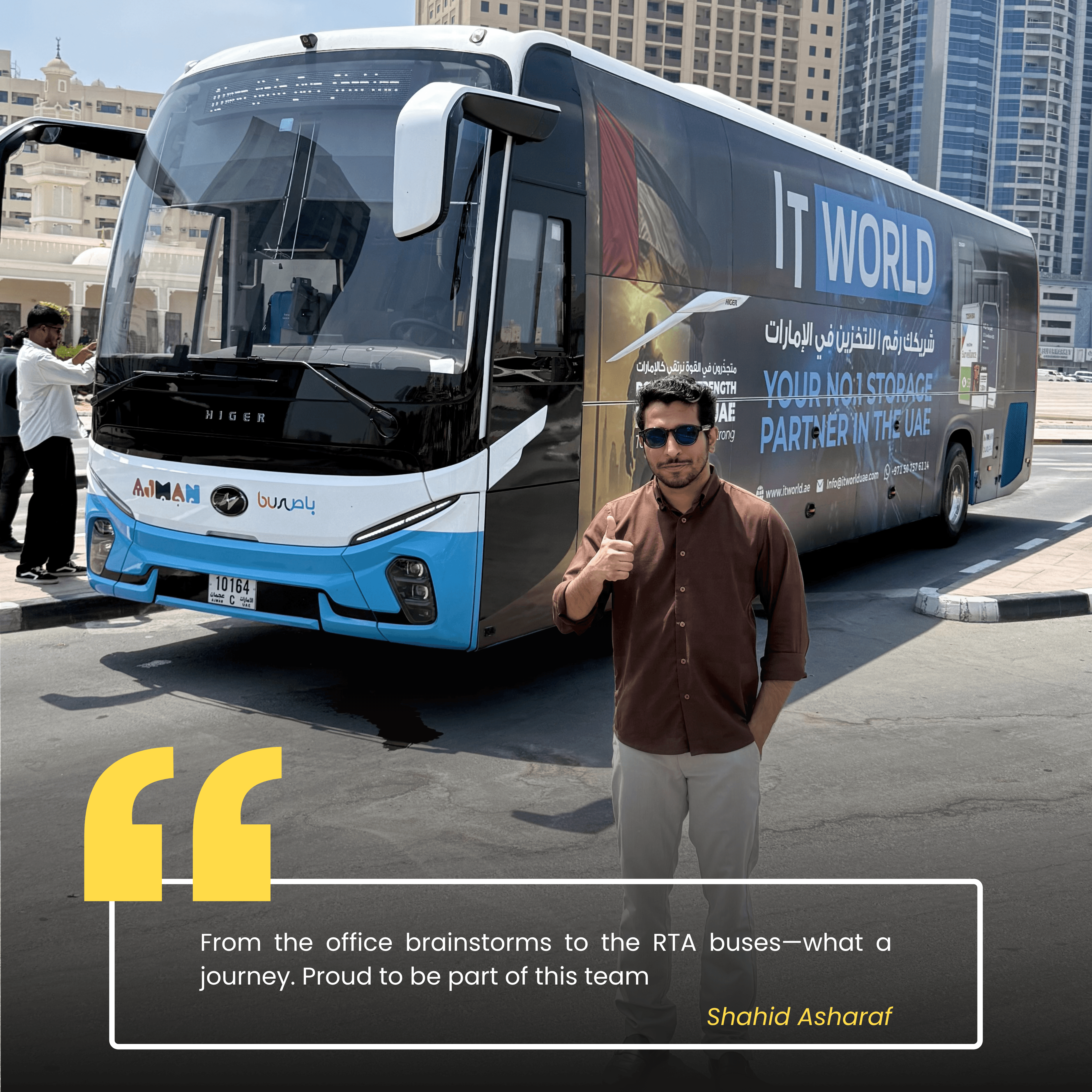 Shahid — IT World Trading team member, photographed beside the RTA campaign bus